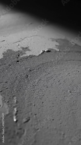 Dynamic Liquid Spreading Across Textured Surface In Dark And Light Tones Abstract Flow