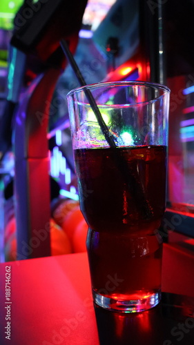 Modern bowling alley interior with neon lights and vibrant graffiti numbers.