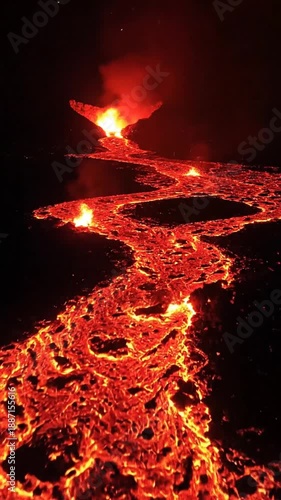 Dynamic Molten Lava River Flowing From An Erupting Volcano At Night