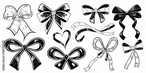 A collection of decorative black and white ribbon bows and heart shapes