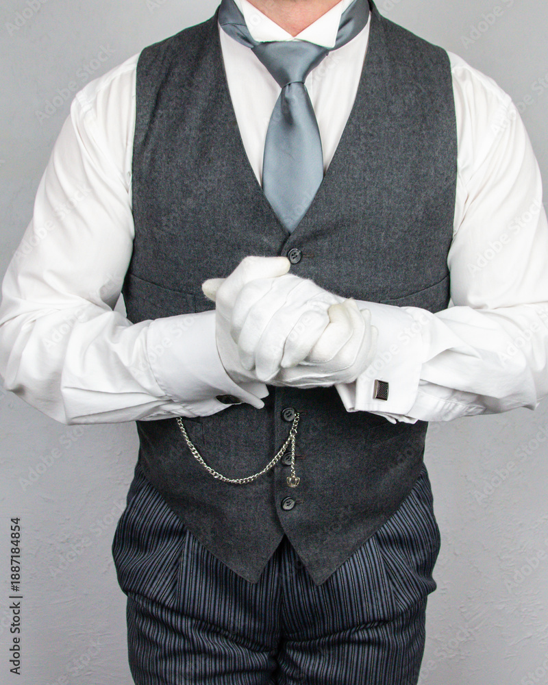 Fotografie Butler or Hotel Concierge in Waistcoat and White Gloves Eager to Be of Service