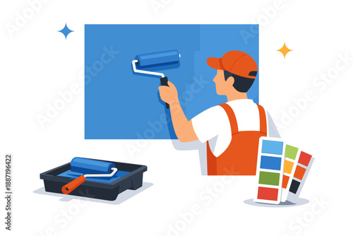 Young caucasian male painting wall with roller and color swatch guide