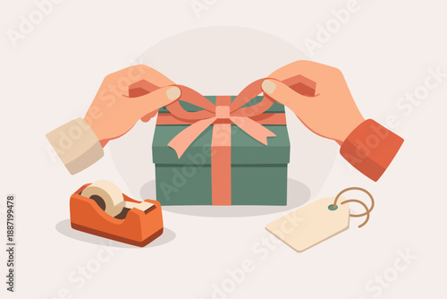 Hands wrapping gift box with ribbon and tape dispenser