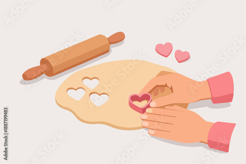 Hands making heart-shaped cookies with rolling pin on dough