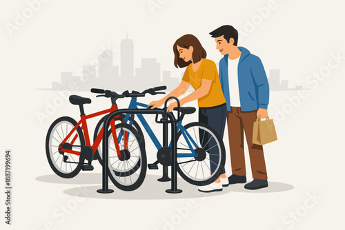 Young adults locking bicycles at urban bike rack