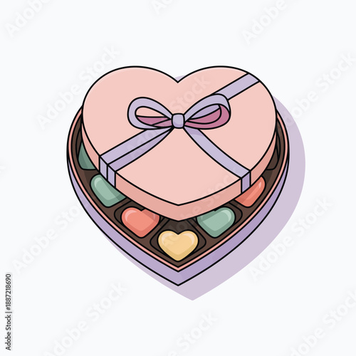 Heart-shaped box with assorted chocolates and a pink ribbon