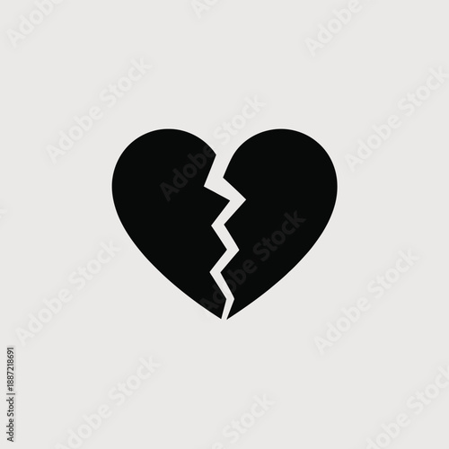 Broken black heart with a jagged crack in the middle