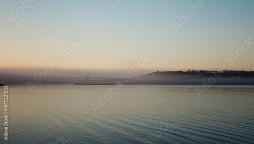 Sunset Over the Lake With Mountains in the Background and Reflection on the Water Surface