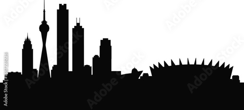 Silhouette of a city skyline with tall buildings and spires on white background