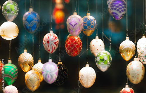 Colorful Easter eggs hanging as festive decoration with blurred background