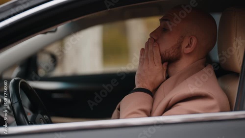 Stressed Man in Car Covers Face Showing Deep Emotional Despair and Overwhelm