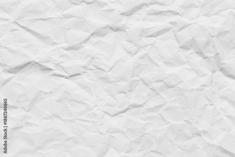 Obraz premium Crumpled white paper texture background,A high-resolution top view of a wrinkled and crumpled piece of white paper, showing detailed creases, shadows, and textures, ideal for background or overlay.