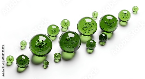 A collection of green glass objects arranged in a diagonal line on a plain surface, viewed from directly above.