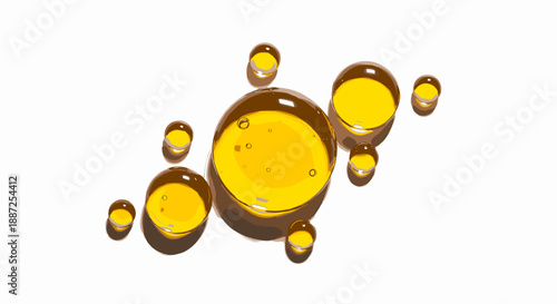 A cluster of yellow transparent oil drops of varying sizes floating in mid-air, viewed from a close-up perspective