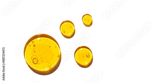 Four yellow liquid droplets of varying sizes floating in mid-air against a plain white background from a top-down viewpoint