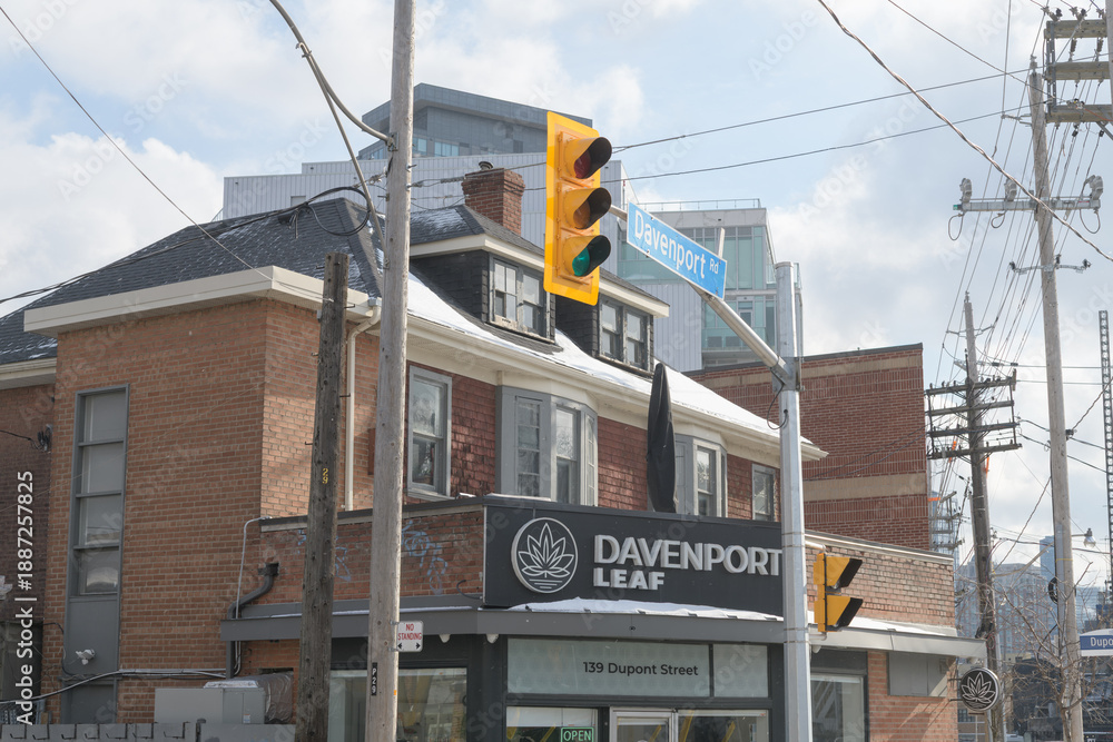 Fototapeta premium exterior building facade and sign of Davenport Leaf, a cannabis store, located at 139 Dupont St, Toronto