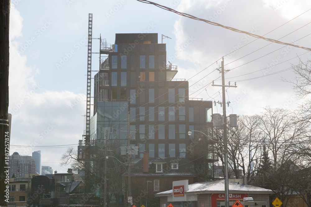 Fototapeta premium construction of 321 Davenport by Alterra (viewed against the sun) in Toronto