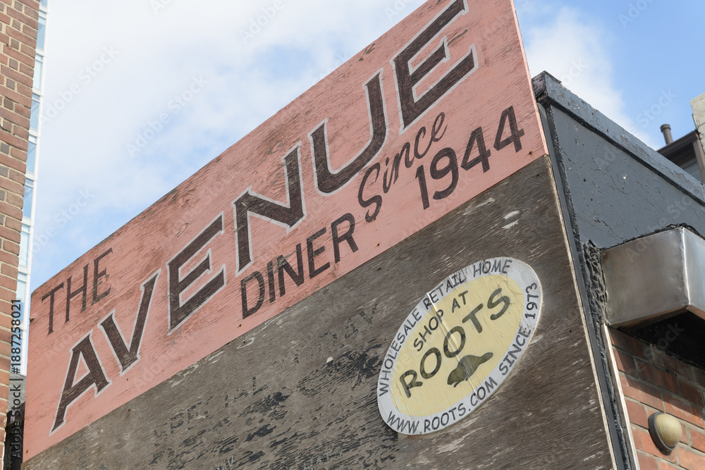 Fototapeta premium old painted sign outside Avenue Diner, a restaurant, located at 222 Davenport Rd, Toronto