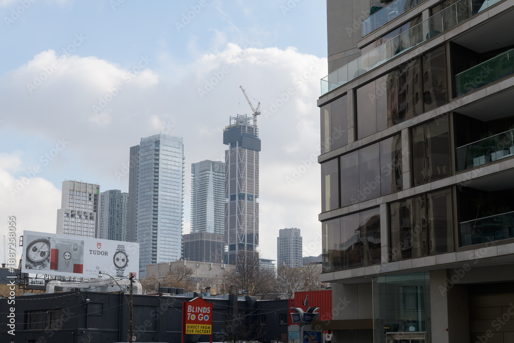 Fototapeta premium looking southeast from Davenport Rd to towers in the Bloor Yorkville area incl construction of One Bloor West, Toronto