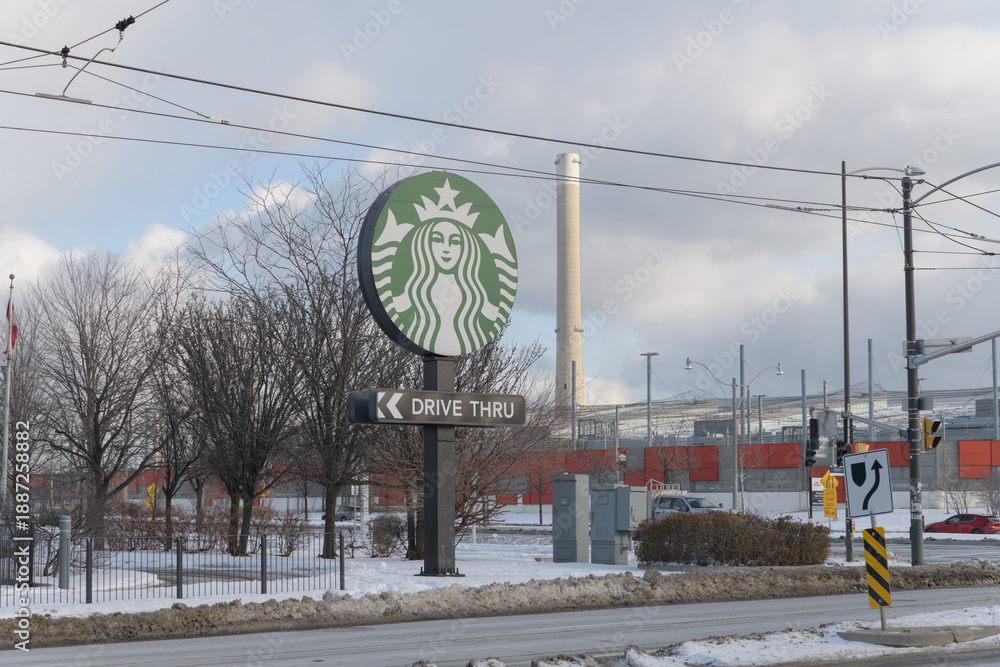 Fototapeta premium round road sign for Starbucks Coffee Company located at 23 Leslie St, Toronto