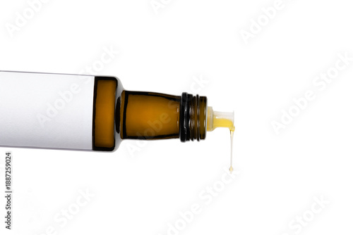 Olive oil being poured through bottle neck tip