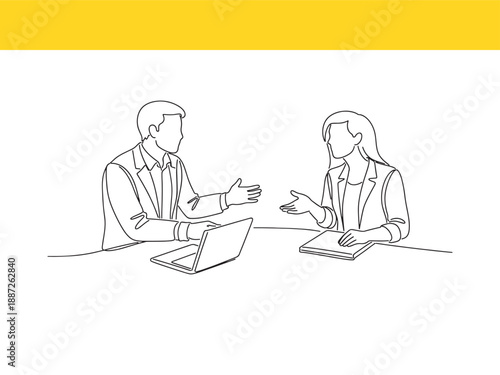 people sitting at table with laptop and notebook discussing