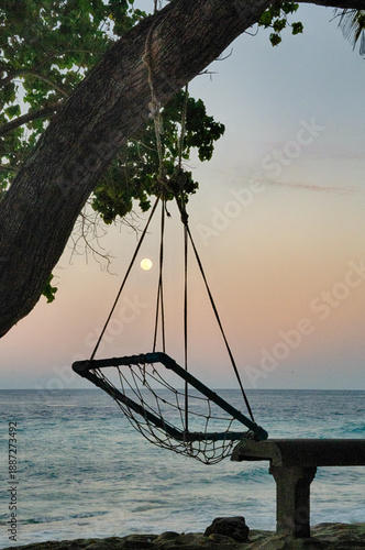Wallpaper Mural Relaxing view of Fuvahmulah Thoondu Beach as the moon rises over the ocean at dusk Torontodigital.ca