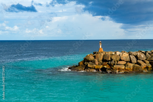Wallpaper Mural Visit to Fuvahmulah Hafen with a view of the lighthouse and water under a cloudy sky Torontodigital.ca