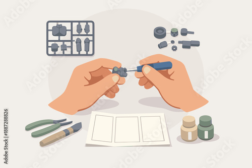 Hands assembling model kit with tools and parts