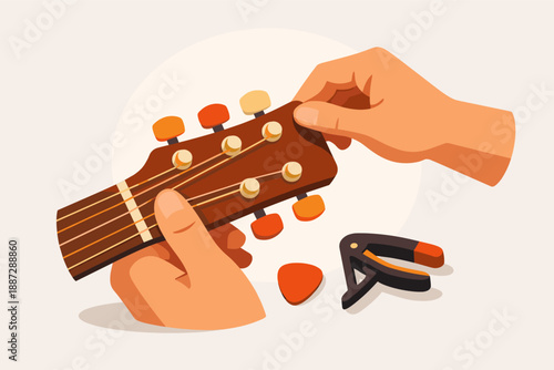 Hands adjusting guitar tuners with capo and pick