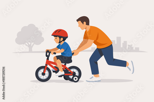 Father teaching son to ride bike with training wheels in park