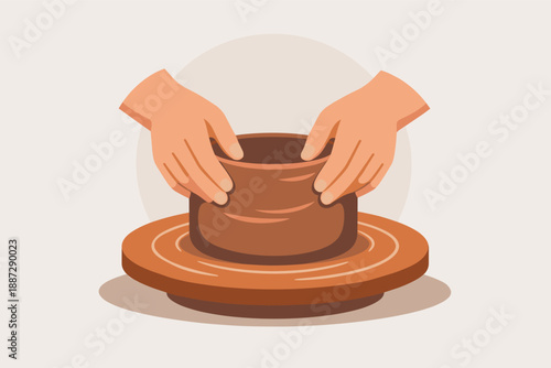 Hands crafting clay pot on pottery wheel