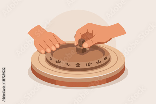 Two hands creating clay art on pottery wheel with stamp