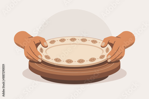 Hands holding decorative plate with leaf patterns on wooden stand