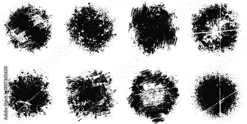 Collection of abstract black splatters and splashes arranged in a grid pattern on a plain background from a direct viewpoint