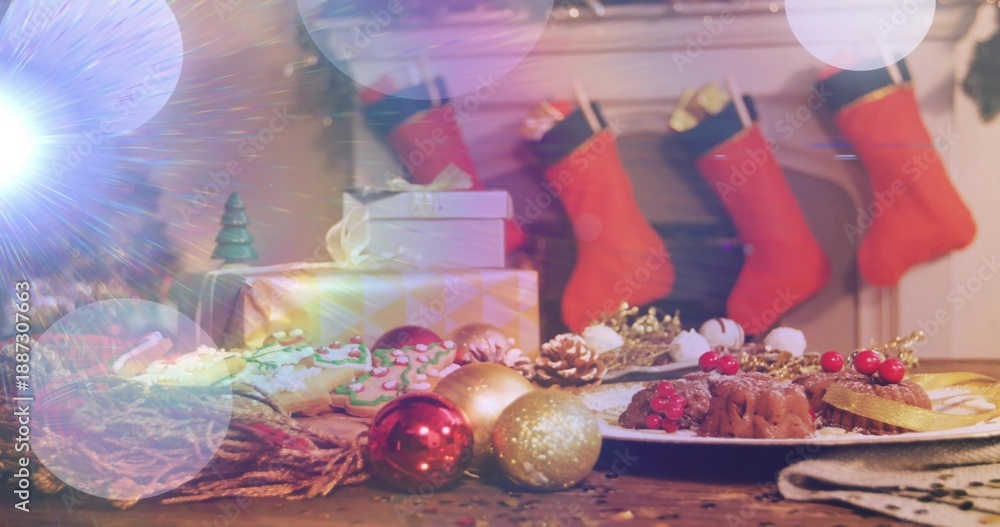 Fototapeta premium Displaying festive table scene glowing on wood surface in living room with desserts and red baubles