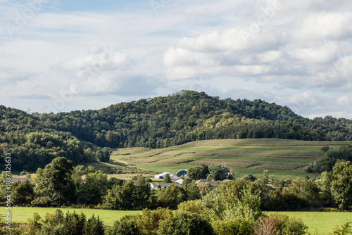 Rural Farm Valley with Rolling Hills and Patchwork Fields
