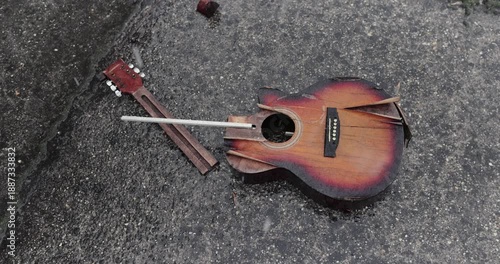 Broken guitar in snowy rain