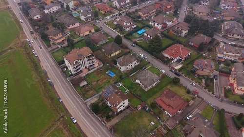 Suburban Aerial View: A captivating aerial perspective showcases a meticulously planned neighborhood of residential houses, complete with lush green areas. 