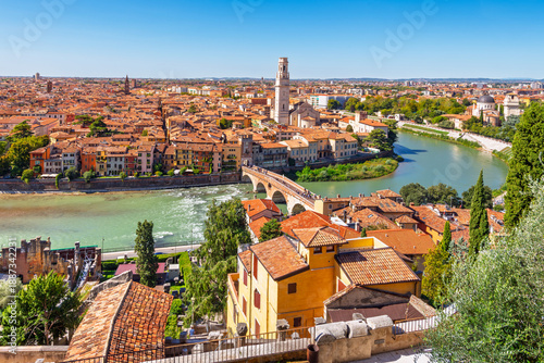 Fotografie View of the historic center of Verona, Italy and the Ponte Pietra bridge and river Adige from the hillside fortress of Castel San Pietro