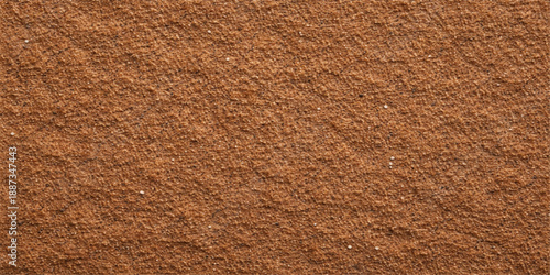A closeup of a rough brown leather texture background showing a natural grunge pattern on an old textured material surface for a macro design backdrop