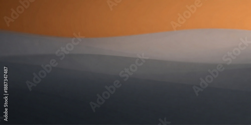 An abstract black and white landscape captures a misty mountain valley at sunrise where the sun glows through clouds and fog to create a silhouetted nature view