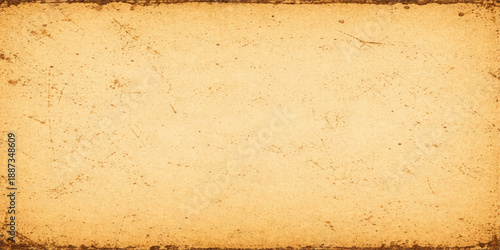 A blank vintage parchment with a stained brown grunge texture provides an aged antique paper background featuring a rough sepia surface and an ancient retro pattern for design