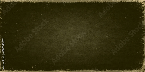 A worn and aged vintage grunge paper texture featuring a stained brown antique parchment design and a dark retro film strip backdrop for a grungy blank book page pattern