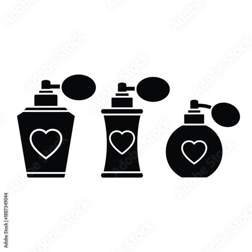Collection of three antique perfume atomizer bottles featuring heart outline icons clearly displayed