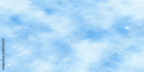 A beautiful clear blue sky with fluffy white cumulus clouds creates a natural summer cloudscape and a peaceful heavenly atmosphere on a bright day