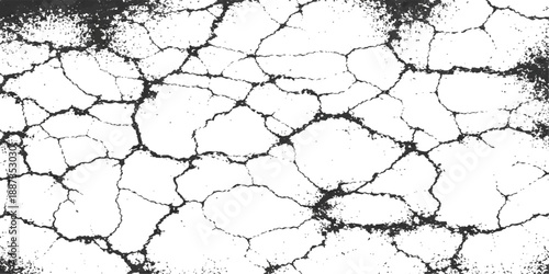 A high-angle shot of dry cracked earth and arid clay soil showing a textured pattern of brown ground during a heat drought caused by climate warming