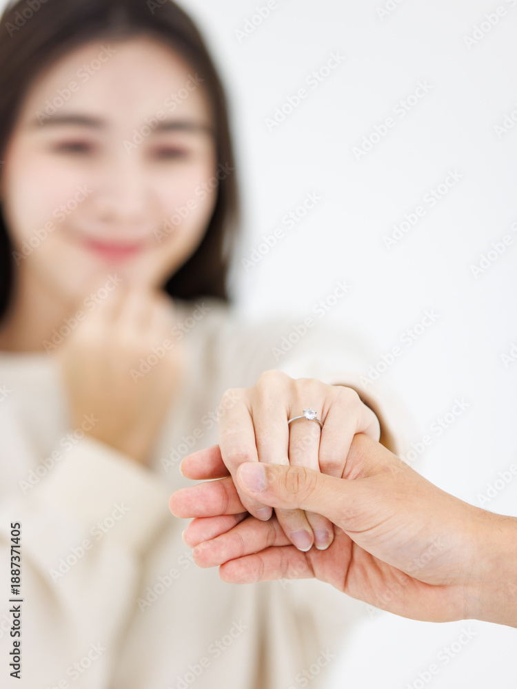 © Bangkok Click Studio - Close up holding hands asian young loving couple showing rings wedding love together relationship good time moment commitment sweet happy beautiful jewelry romantic marriage celebrating Valentine Day