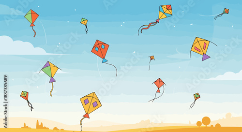 Colorful kites flying freely in a vast open sky above a distant village horizon during a sunny day