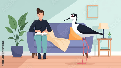 Person sits on couch reading book as tall bird stands nearby